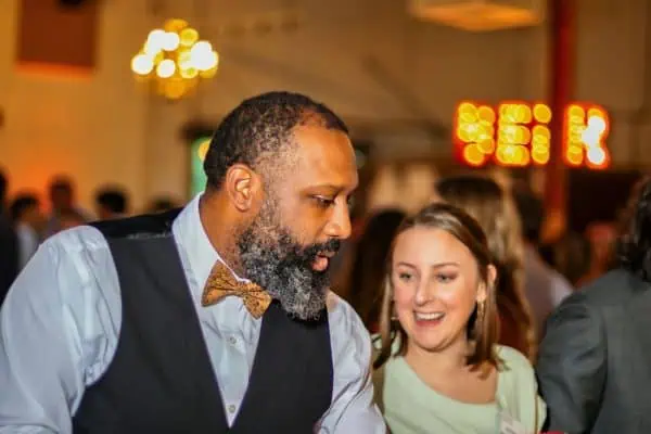 Man and woman enjoying a fundraising event for childhood cancer awareness.