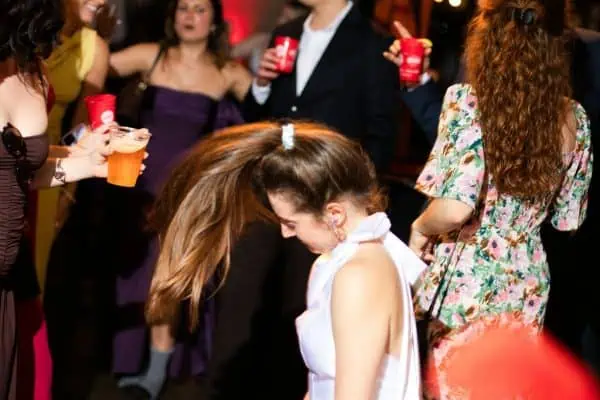 People celebrating at a charity event for childhood cancer awareness.
