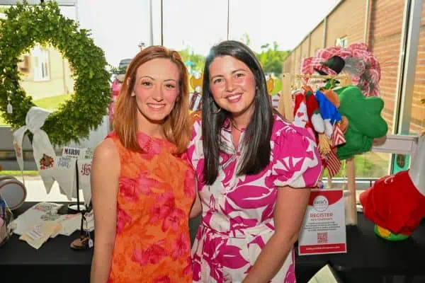 Two women smiling at CURE Childhood Cancer event in Bryan County.