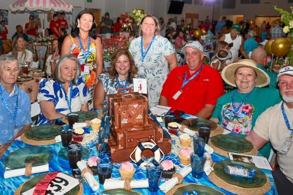 Group of people at a charity event for childhood cancer awareness.