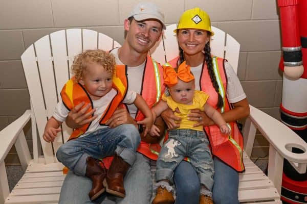 Family with children at CURE Childhood Cancer gathering in safety vests.