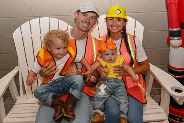 Family with children at CURE Childhood Cancer gathering in safety vests.