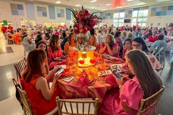 Women at a charity event for childhood cancer awareness and fundraising.