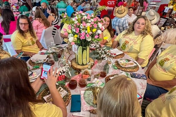 Group of women at a charity event for childhood cancer awareness.