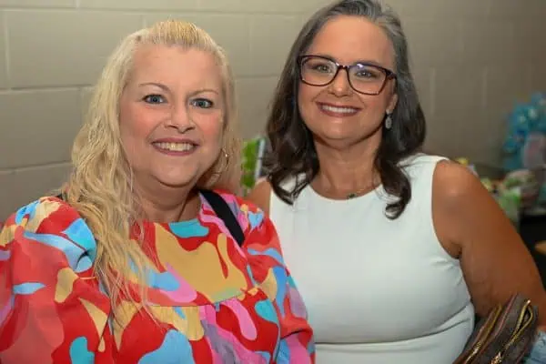 Two women smiling at CURE Childhood Cancer event in Bryan County.