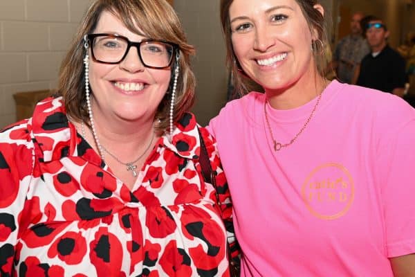 Two women smiling at CURE Childhood Cancer event in Bryan County.