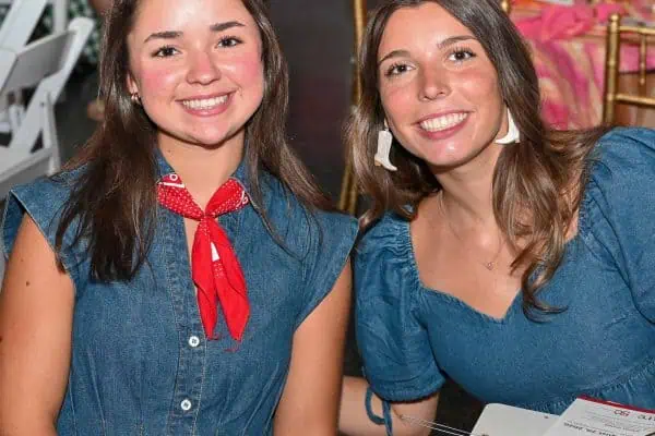 Two smiling young women at CURE Childhood Cancer event in Bryan County.