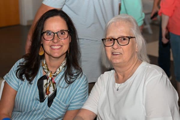 Two women smiling at CURE Childhood Cancer gathering in Bryan County.