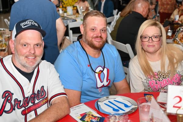 People enjoying a charity event for childhood cancer awareness.