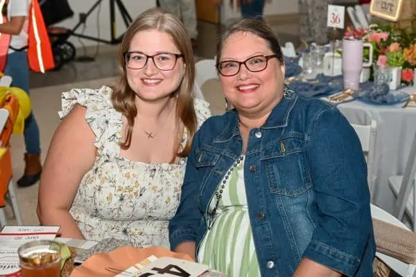 Two women smiling at CURE Childhood Cancer gathering in Bryan County.
