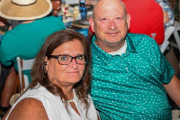 Smiling couple at CURE Childhood Cancer gathering in Bryan County.