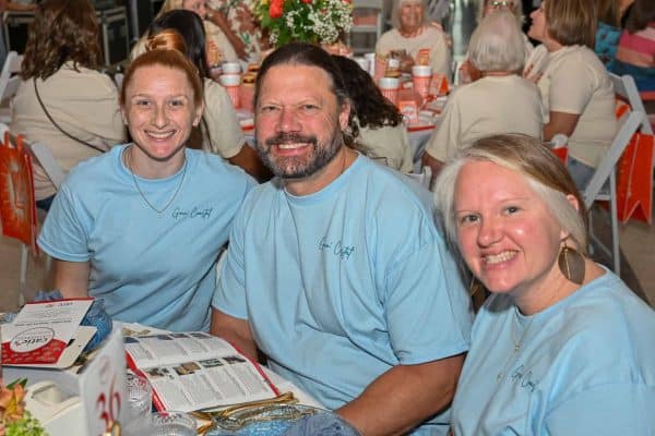 Three supporters for families with cancer at Catie's Gathering event